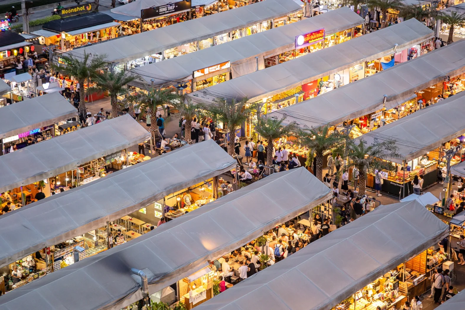 the Jodd Fairs night market seen from above with lots of people and beautiful lights