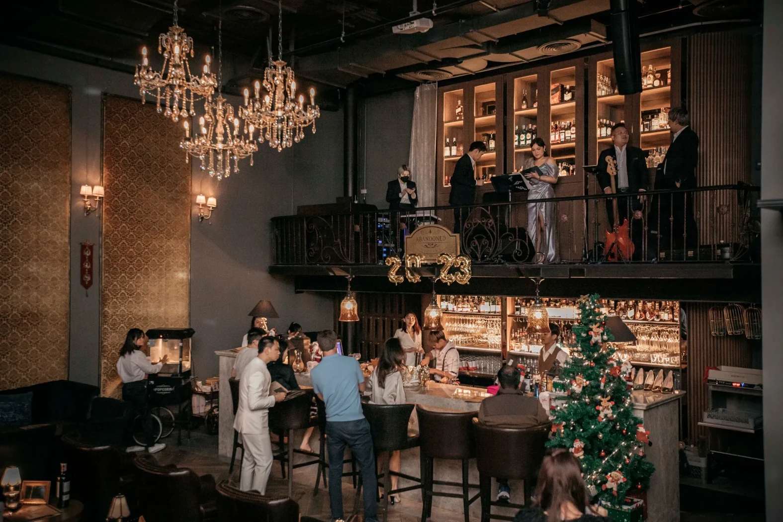 the bar and mezzanine of the Abandonned Mansion with a live band