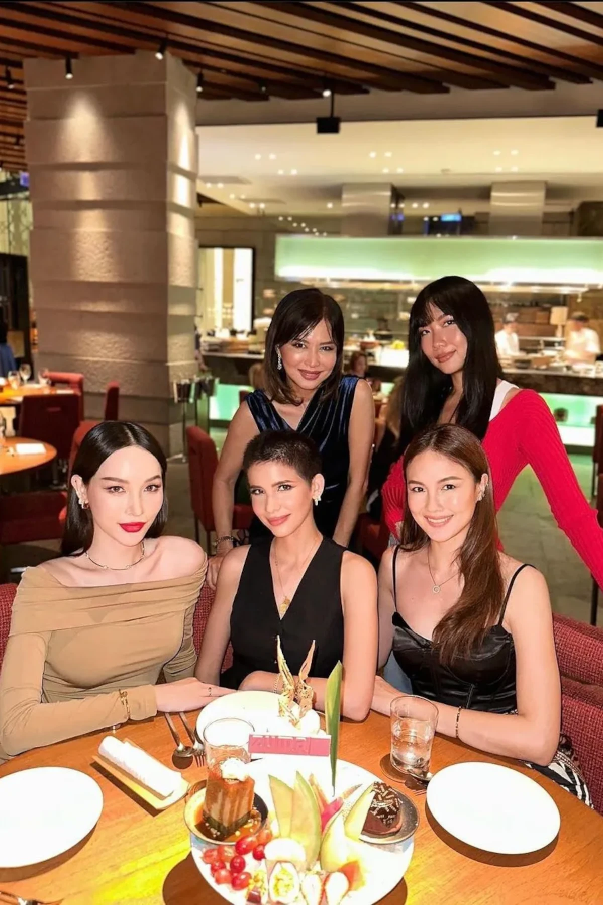 Beautiful girls at Zuma in Bangkok enjoying some drinks and dessert in the main room.