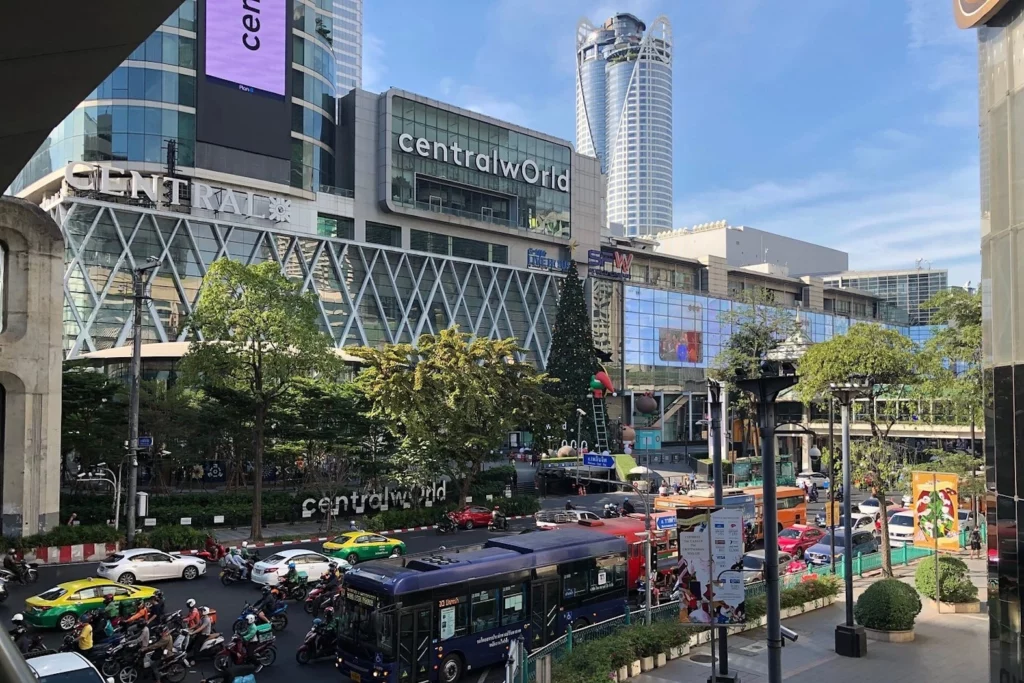 exterior of CentralWorld shopping mall in Bangkok with a lot of traffic in front of the building