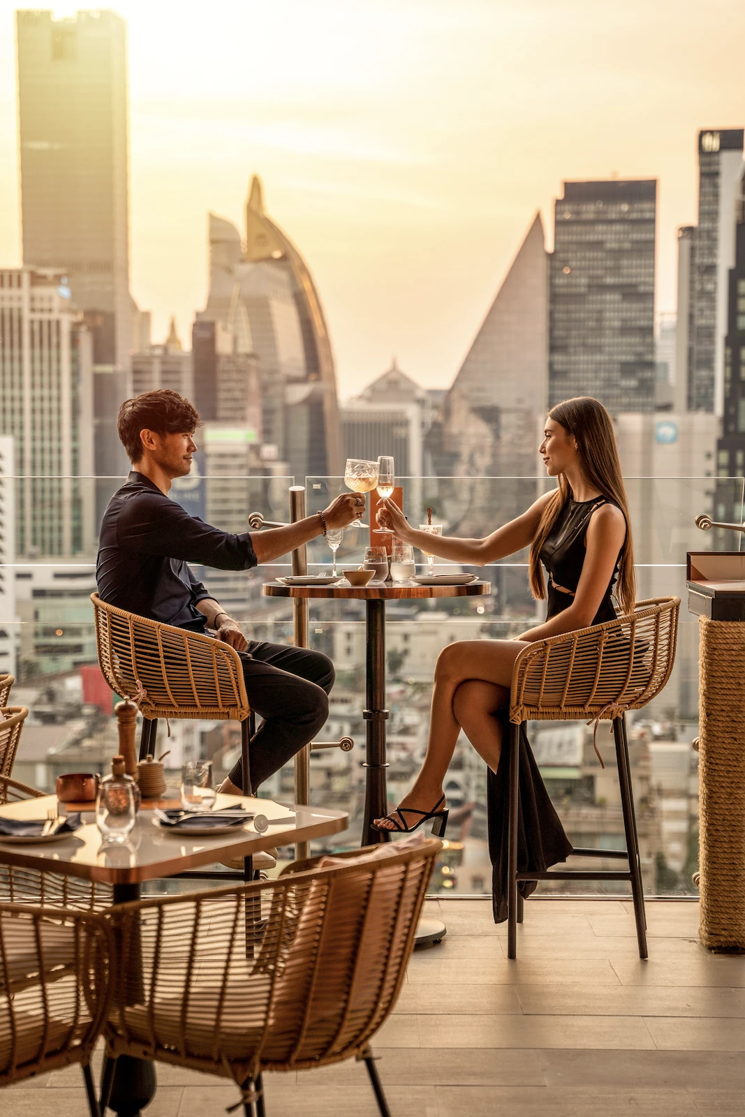 couple drinking champagne during the sunset at Pastel Bangkok