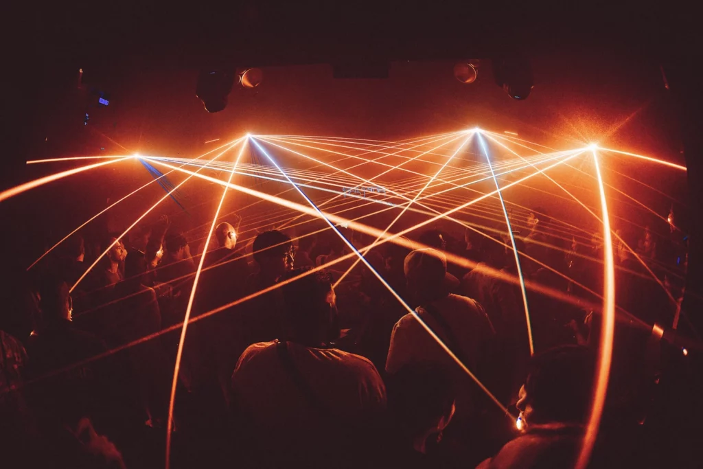 Eden Club Bangkok with red lazers and people dancing