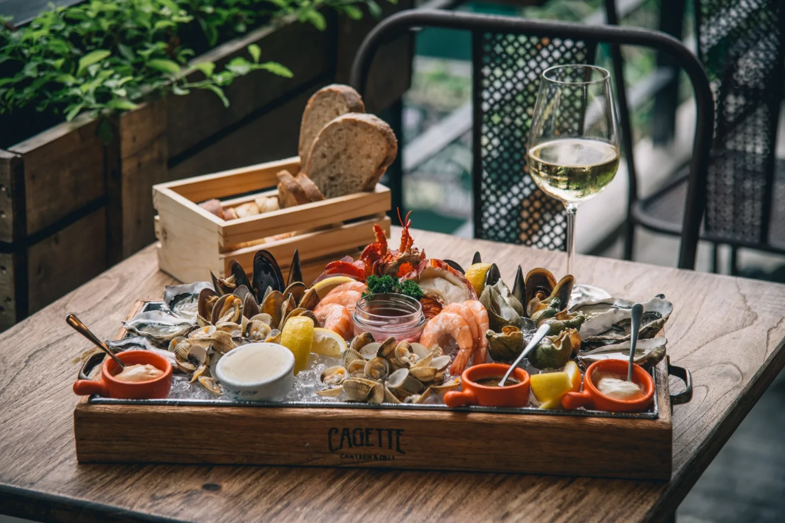 french food platter at the cagette restaurant bangkok with oysters and shrimps