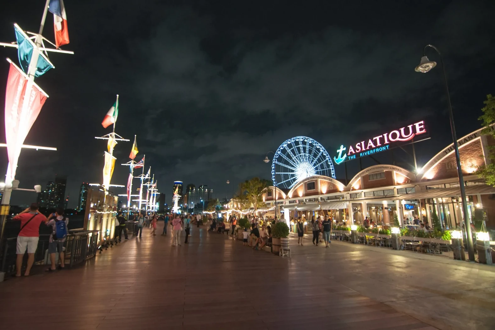 Asiatique The Riverfront night market, illuminated and bustling with activity.