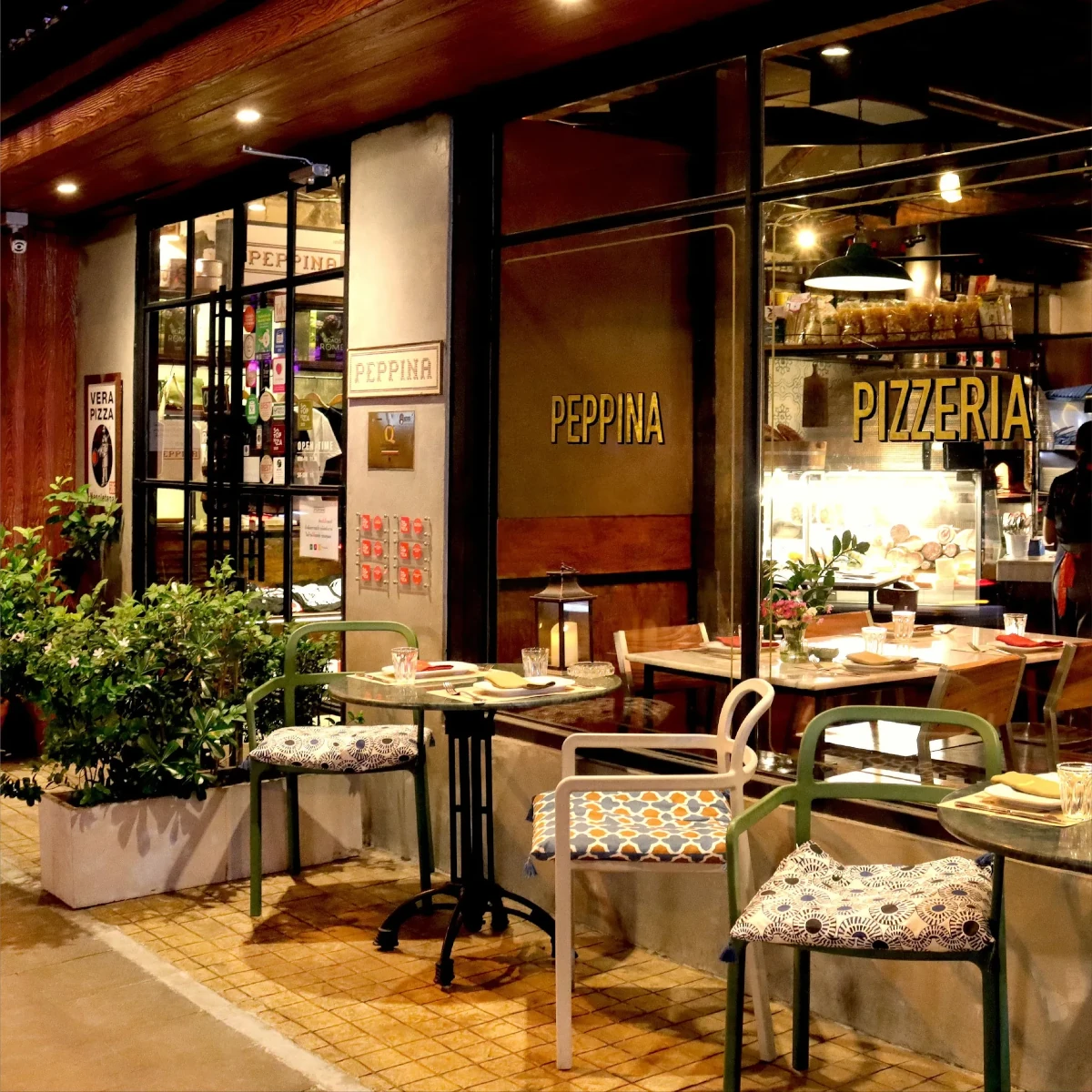 Welcome to Peppina Pizzeria, where the inviting ambiance meets authentic Italian flavors in the heart of Bangkok.