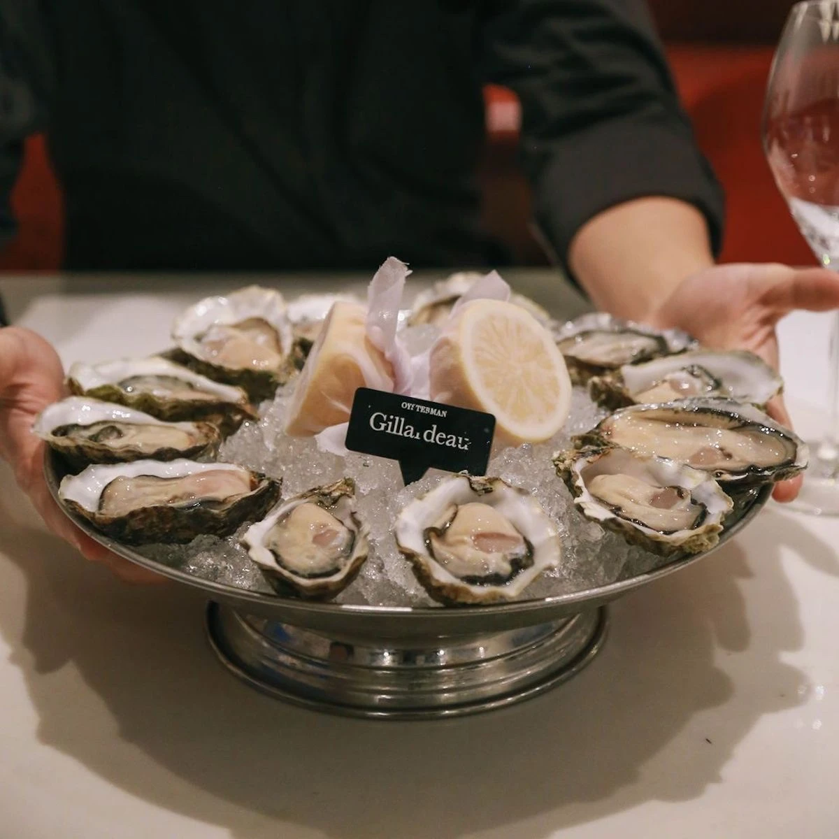 Here are Gillardeau oysters with lemon served by a runner at The Oysterman restaurant in Bangkok.