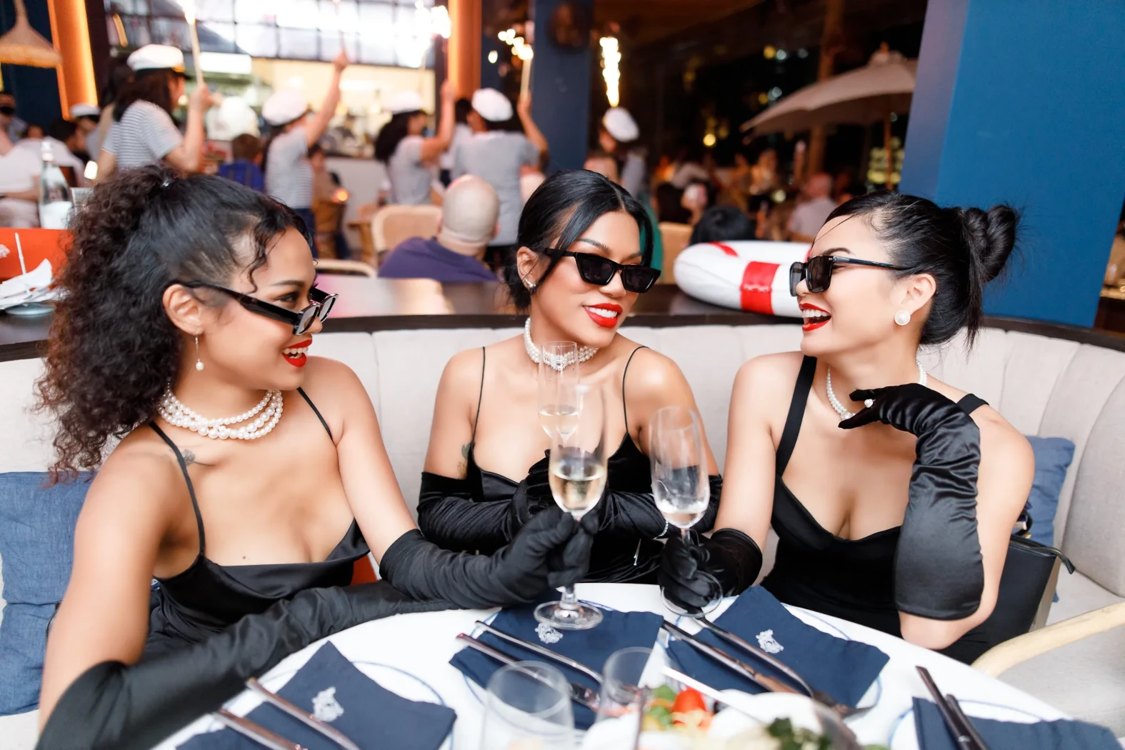 Group of girls in black dresses, smiling at a hen night at Pastel in Bangkok