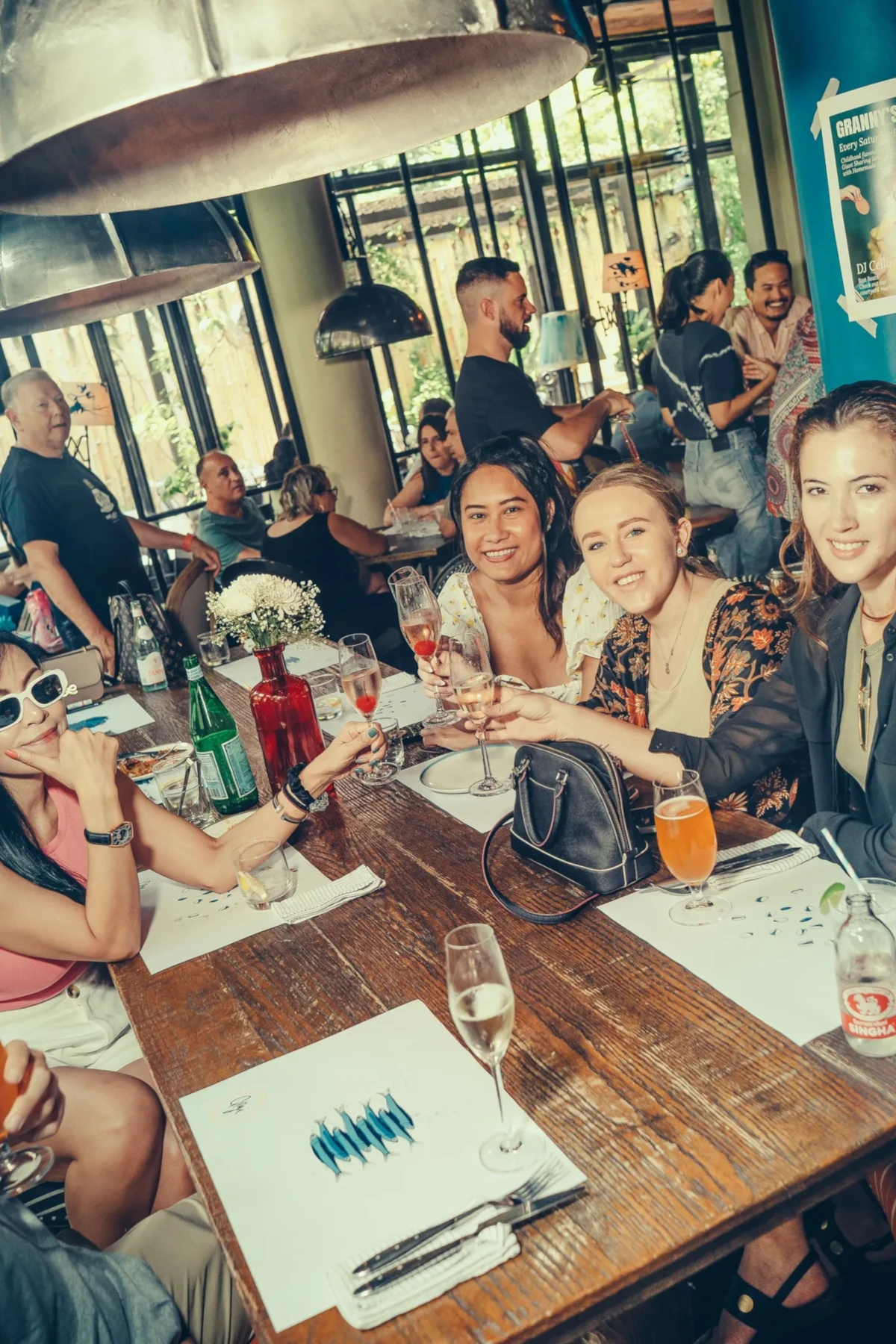 A group of girls posing and drinking some glasses at Gigi Bangkok restaurant in Sukhumvit area.