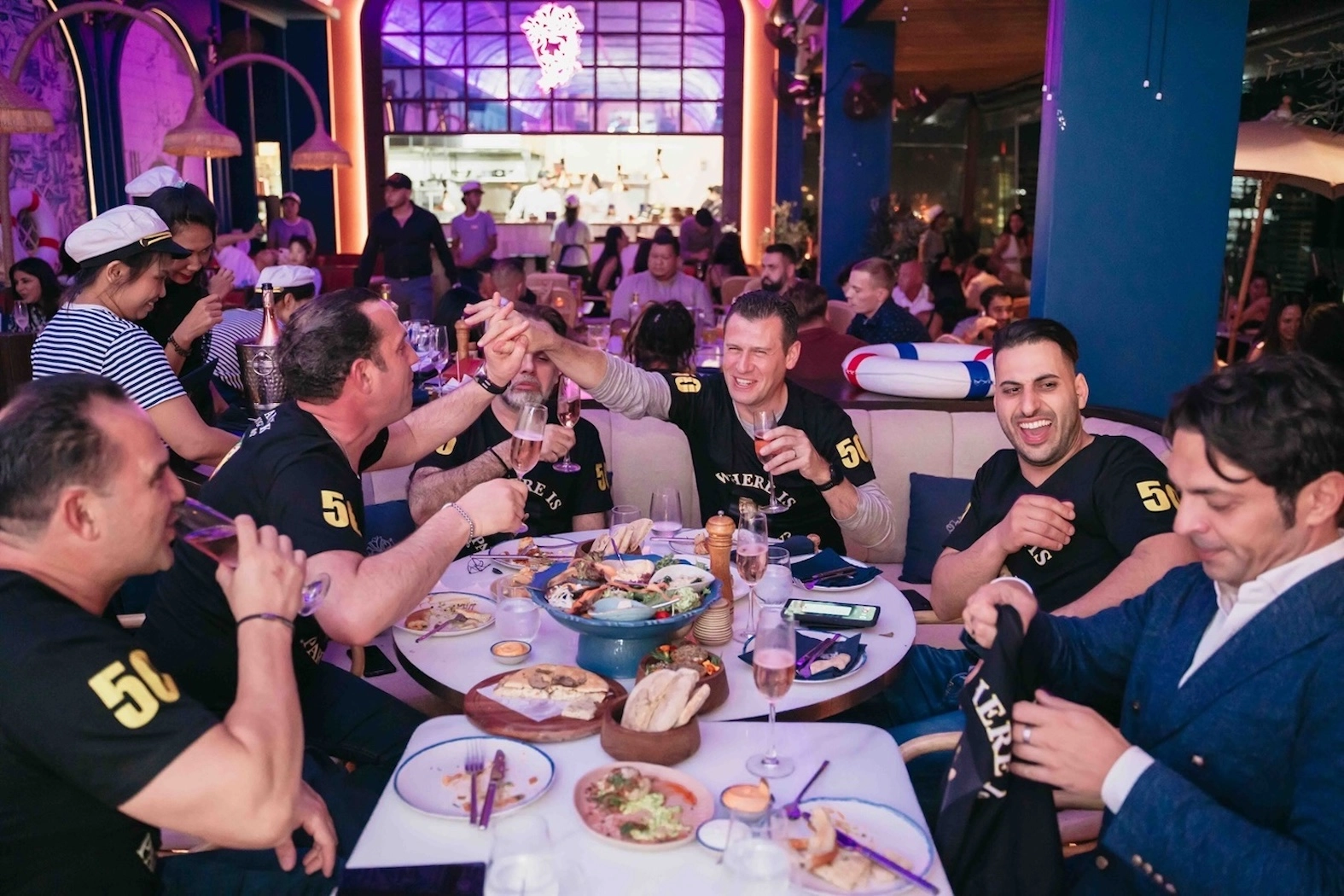 group of guys celebrating a bachelor party at Pastel Rooftop Bar in Sukhumvit Soi 11