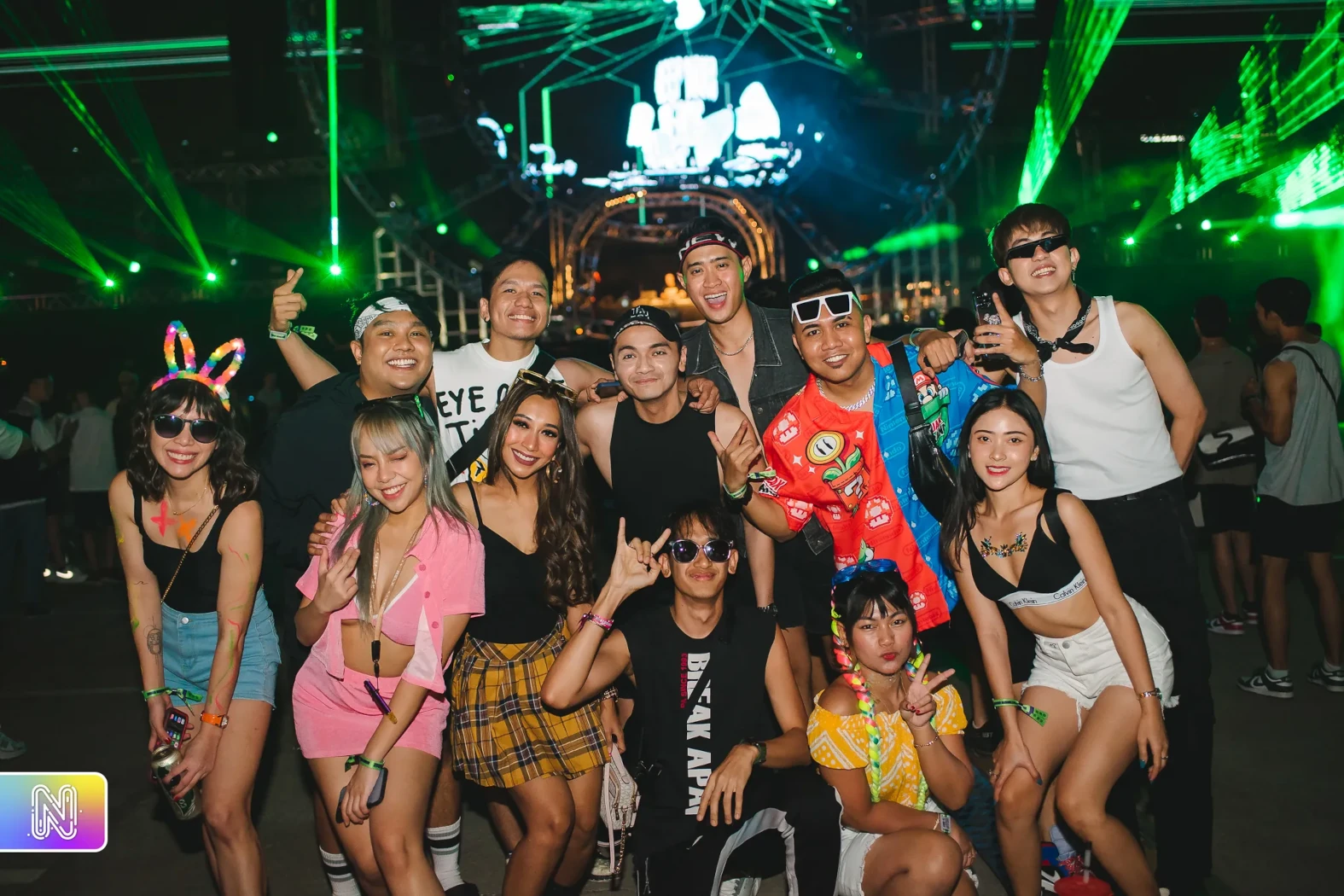 Photo of a group of people enjoying the Neon Countdown music festival in Thailand.