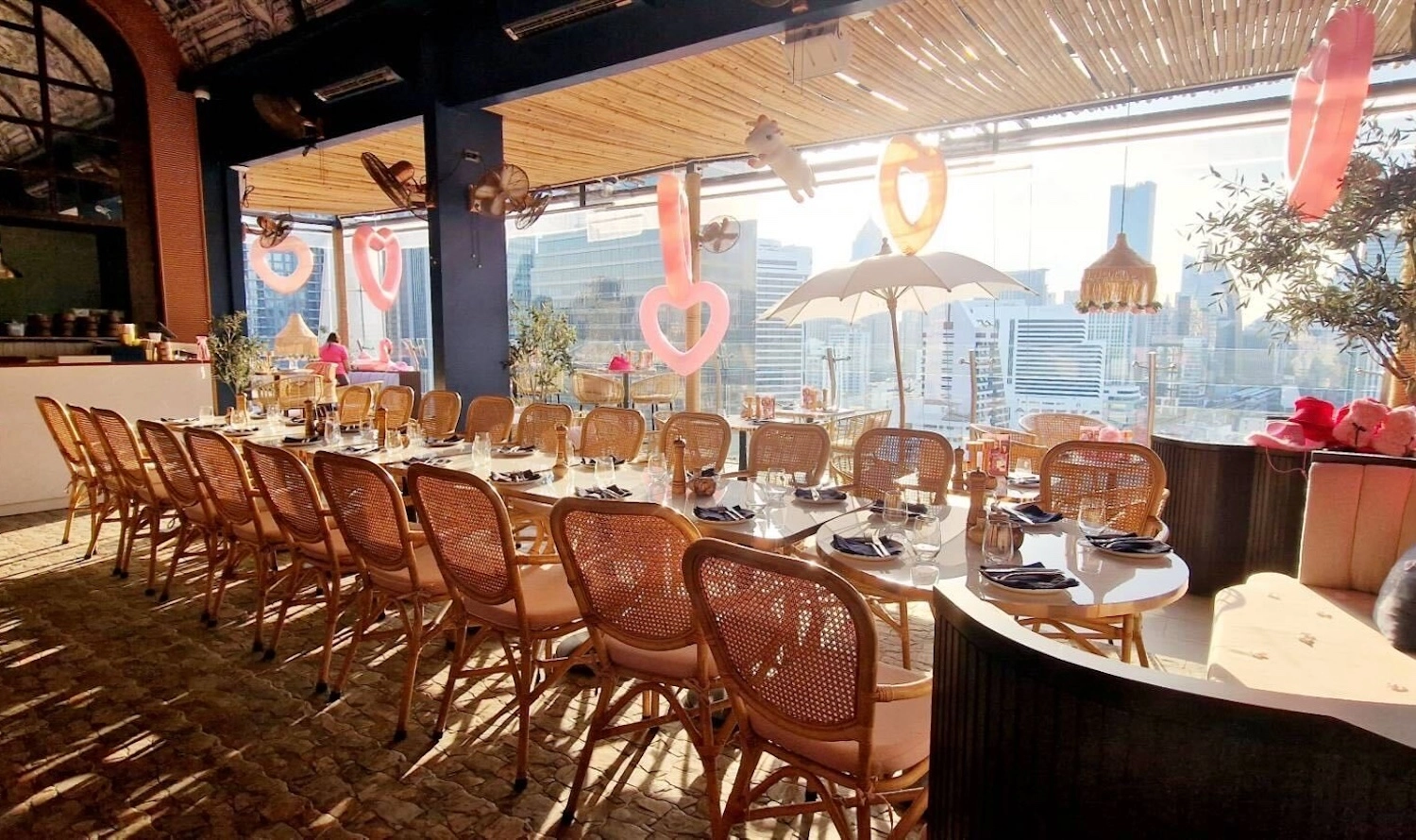 table for a group of 25 people at Pastel Bangkok restaurant during the sunset