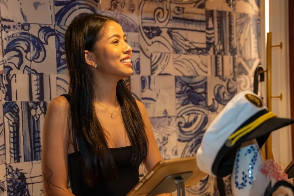 hostess Mimi working smiling at customers arriving at Pastel Bangkok
