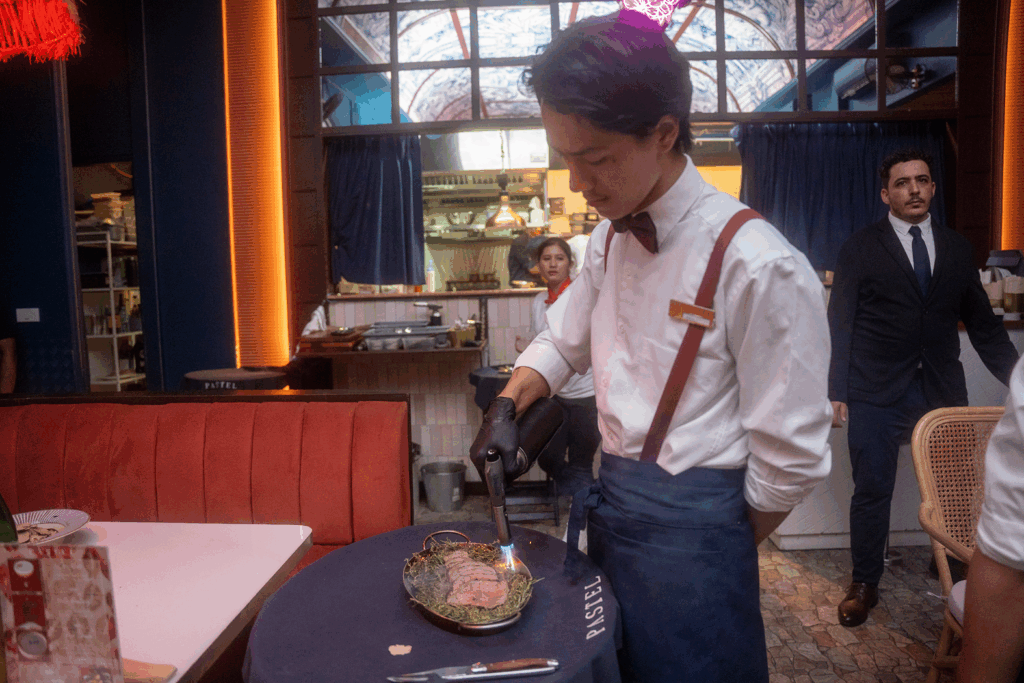 ma chérie staff waiter cooking the lamb rack (2) 1
