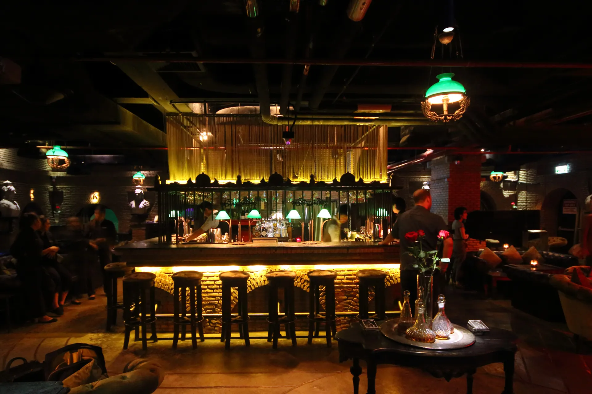 Photo of the bar and warm lights at the Maggie Bangkok