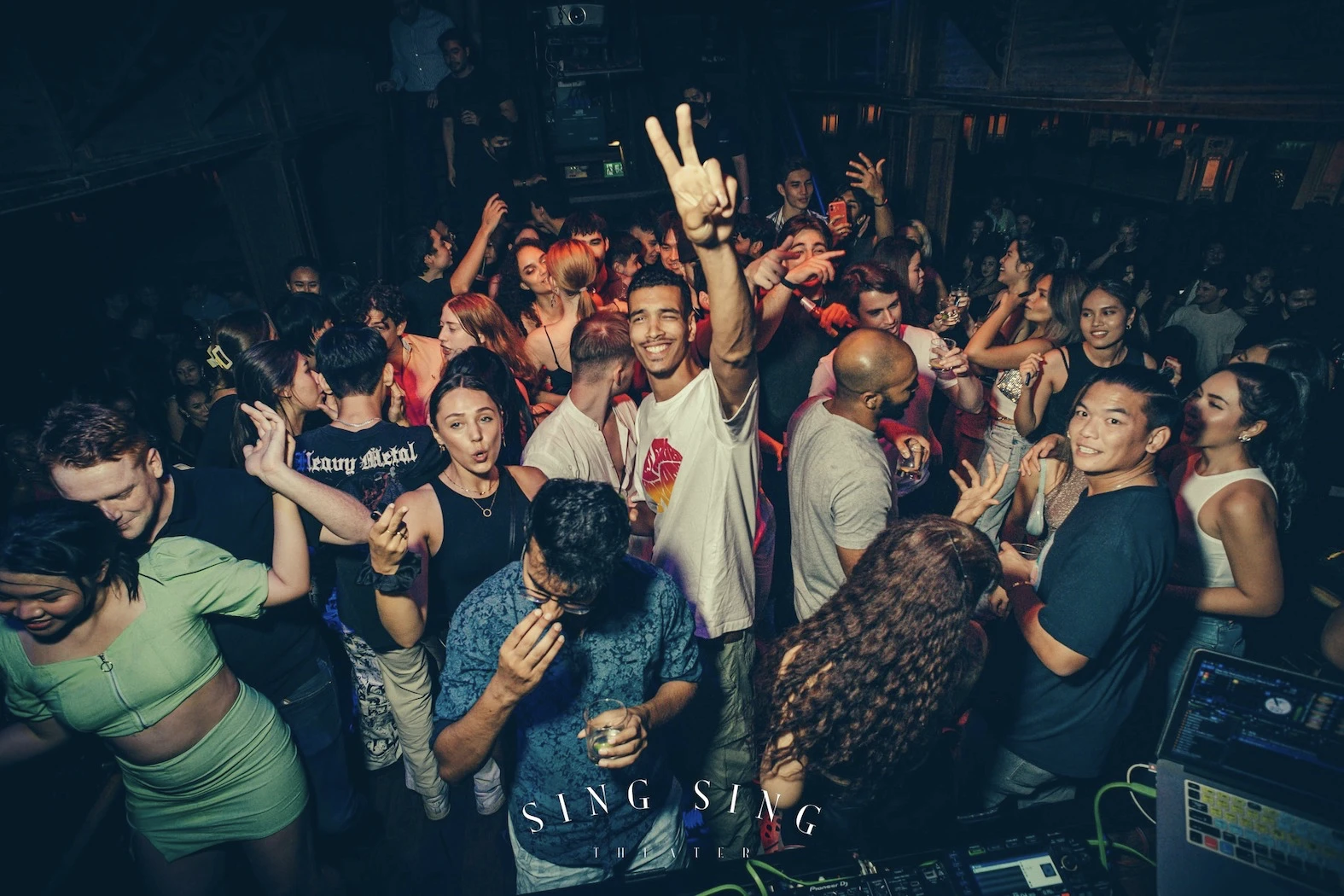 crowd partying and dancing at Sing Sing Theater club in Sukhumvit area in Bangkok Thailand