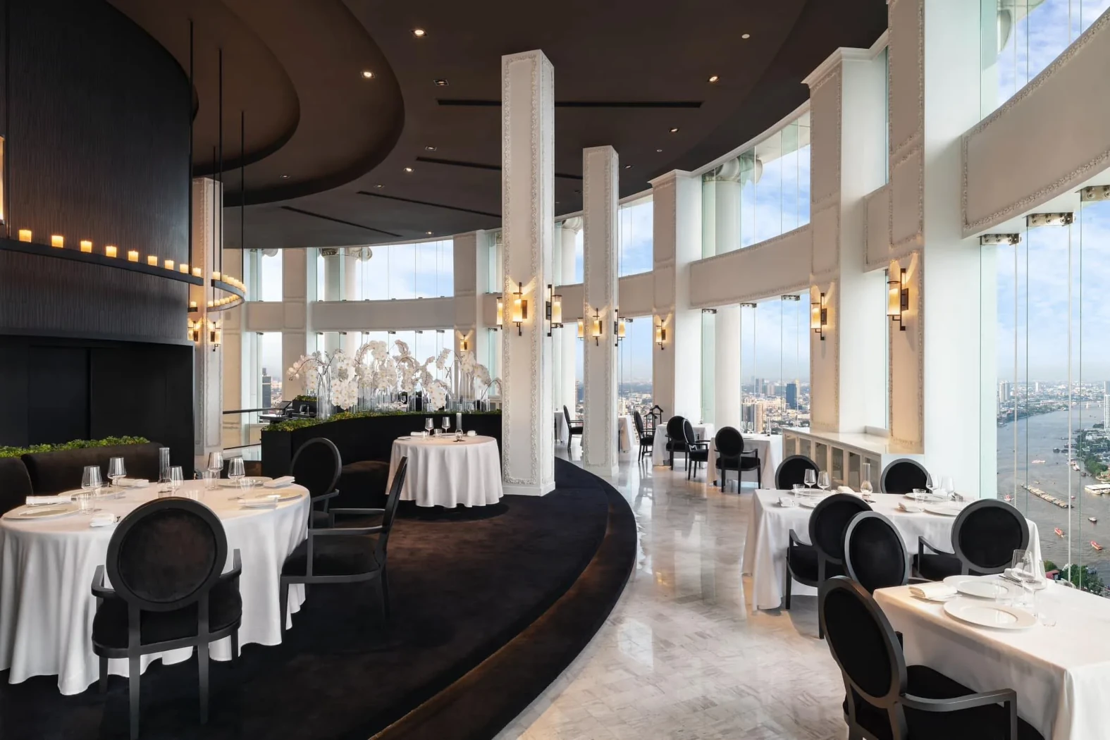 Spectacular ambiance and panoramic views at Mezzaluna, an esteemed Michelin-starred restaurant in Bangkok.