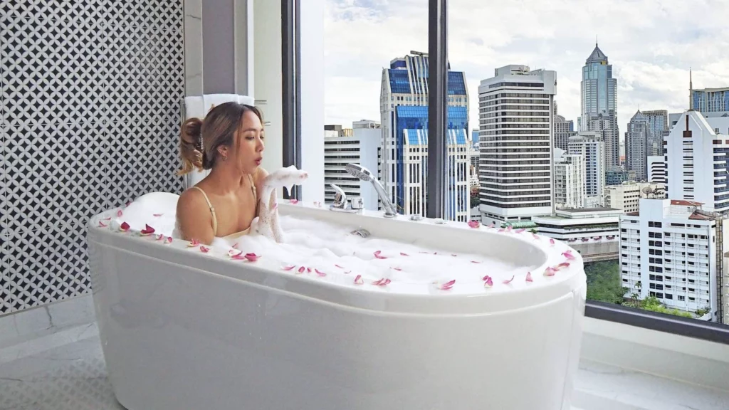 Thai girl in a bathtub in a hotel room at Aira hotel Bangkok in Sukhumvit Soi 11