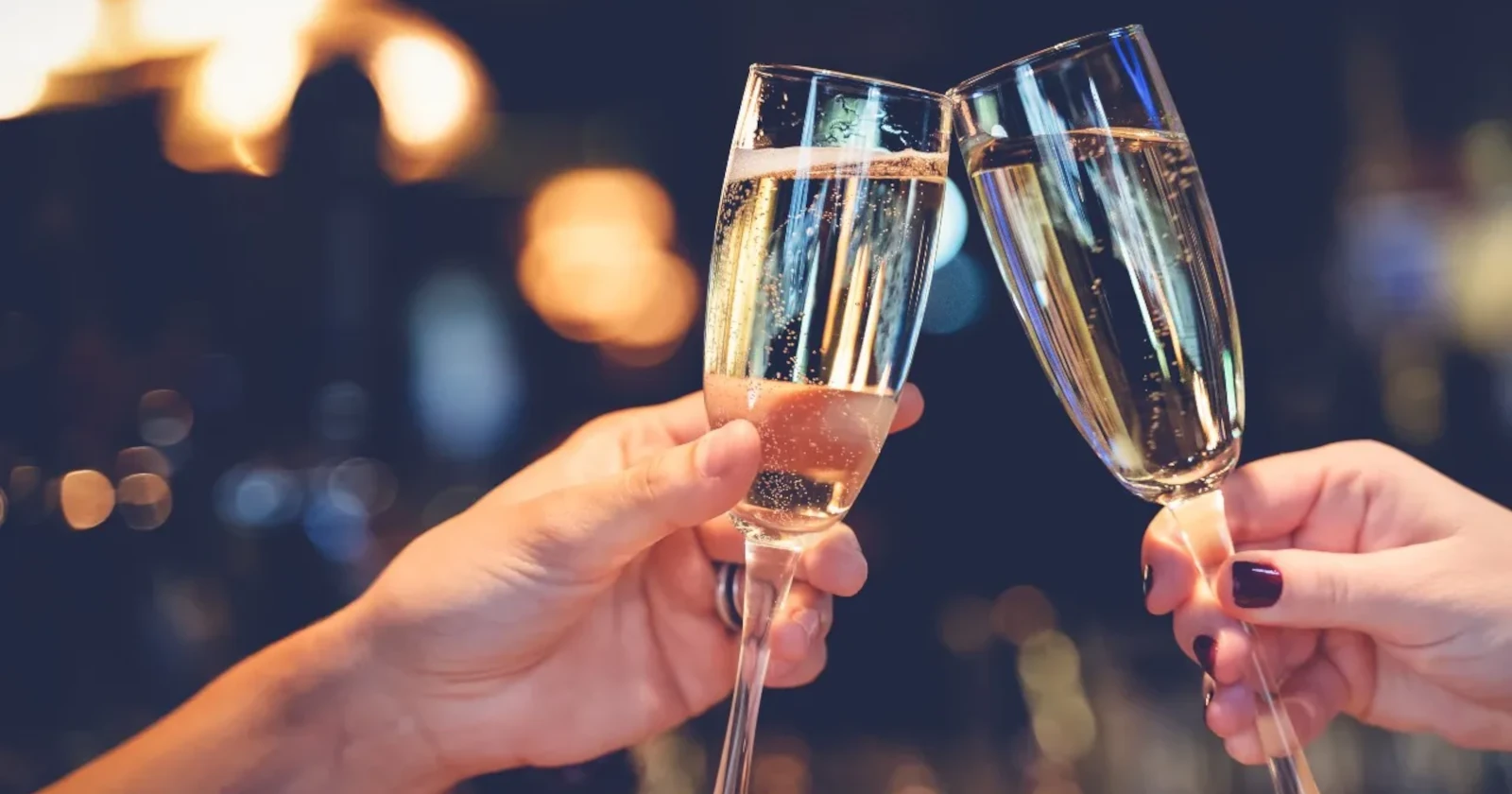 Two glasses of Champagne cheering at a restaurant in Bangkok.