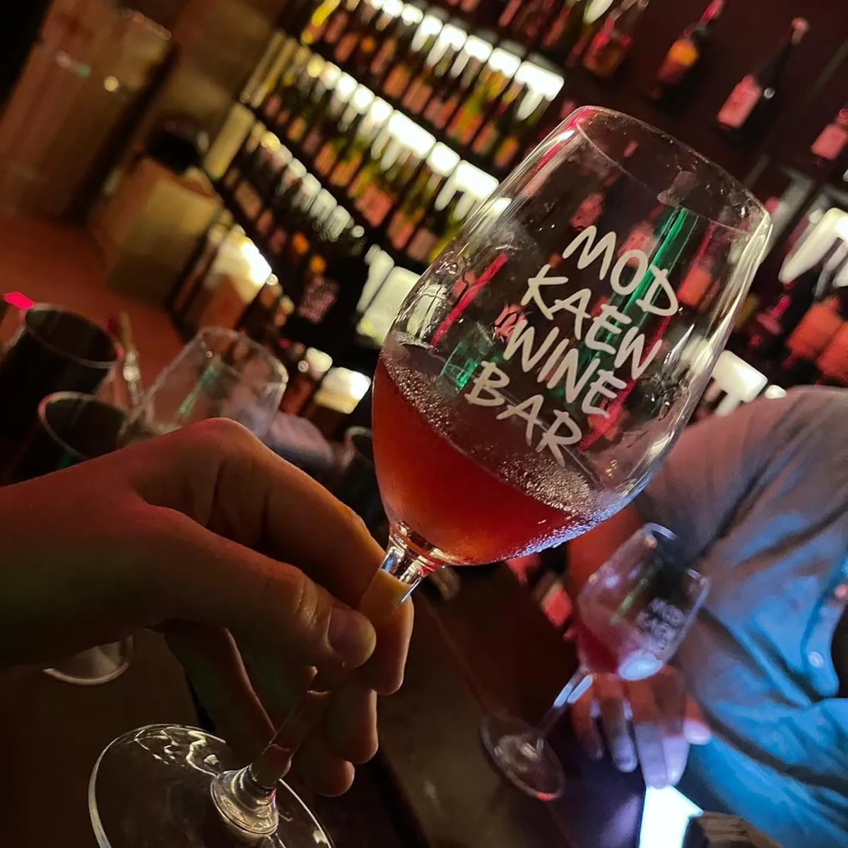 Elegant wine glasses at Mod Kaew Wine Bar in Bangkok, Thailand.