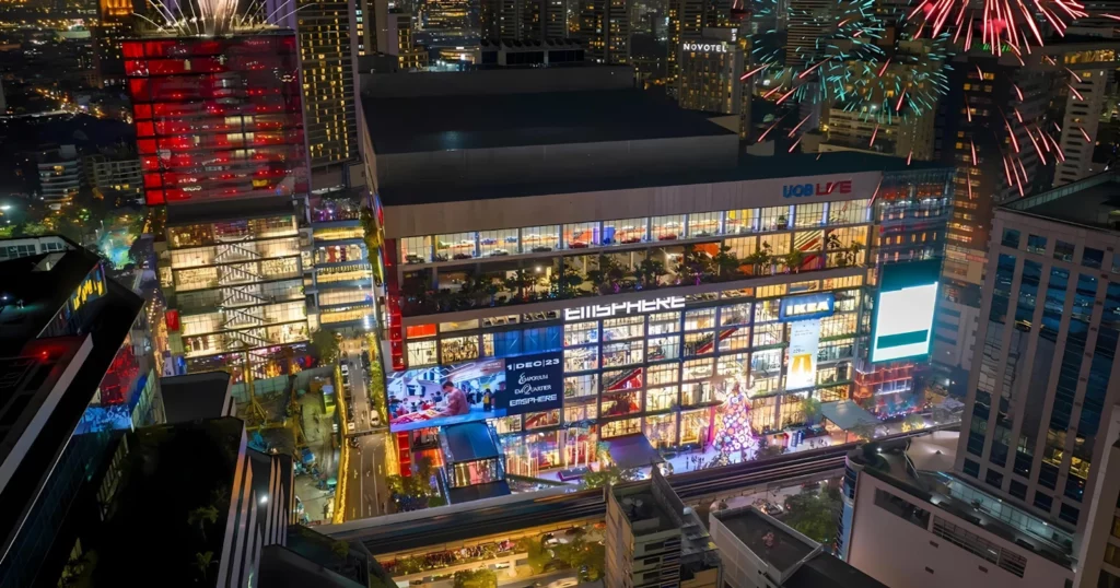 Here is EmSphere Mall during 2024 new year's celebration in Bangkok. We can see the different levels of the mall and UOB Live at the top.